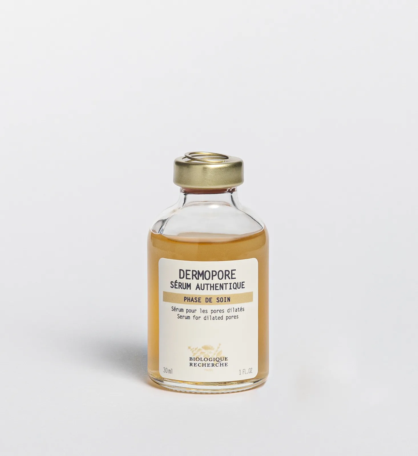 Стеклянный флакон сыворотки Dermopore Biologique Recherche 30 мл с янтарной жидкостью и золотистой крышкой